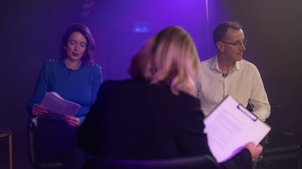 People talking on a stage