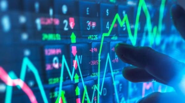 TEC_Hand interacting with financial data on a digital screen.jpg