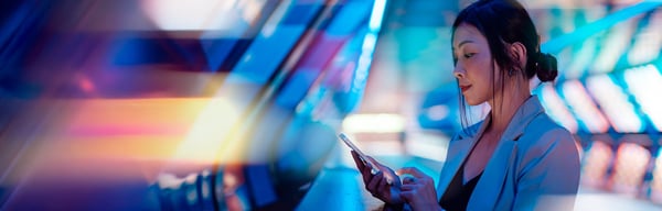 A lady looking at her smart phone.